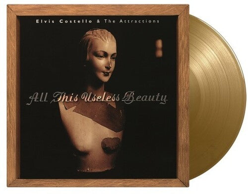 Picture of the Music Record - All This Useless Beauty - Limited 180-Gram Gold Colored Vinyl [Import] by Elvis Costello & the Attractions